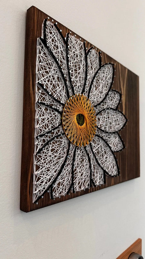 White Daisy stringed on Wood by Lawrence Ross