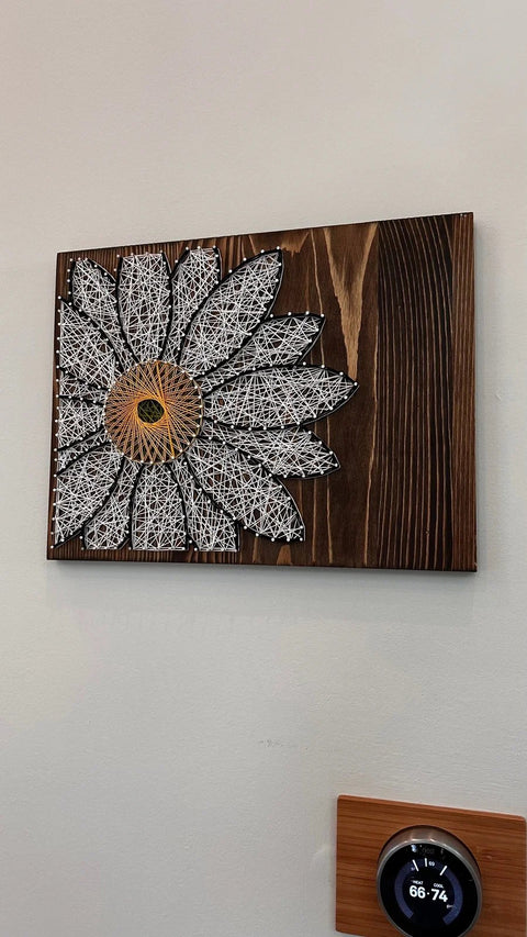 White Daisy stringed on Wood by Lawrence Ross