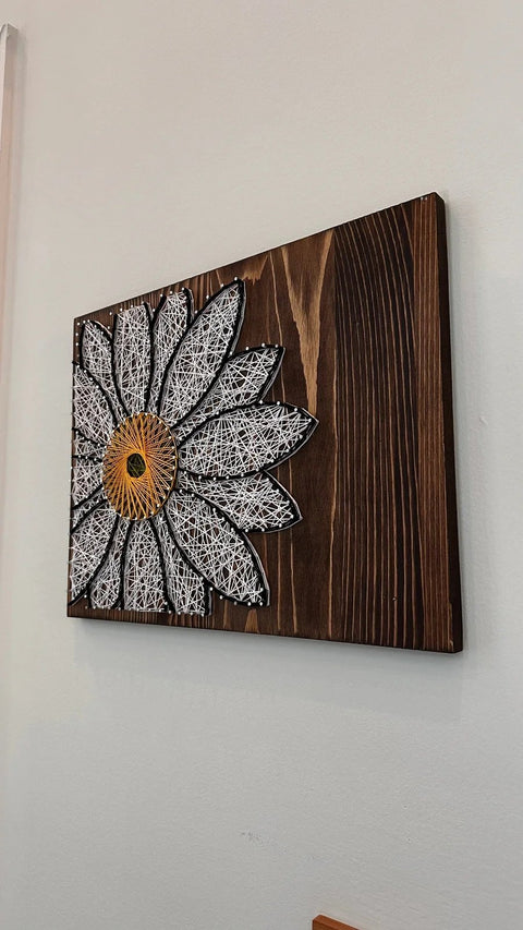 White Daisy stringed on Wood by Lawrence Ross