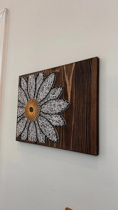 White Daisy stringed on Wood by Lawrence Ross